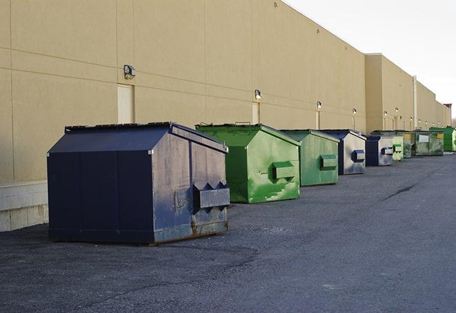 a group of construction workers taking a break near a dumpster in Aydlett, NC